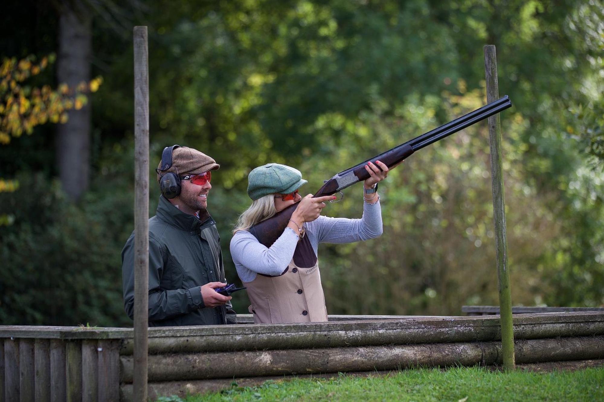 Schloss Roxburghe, Part Of Destination By Hyatt 외부 사진 A woman shooting with a shotgun